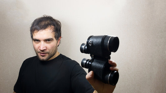 young man with binoculars photo