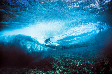 Surfer under the waves photo