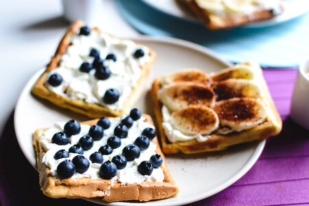 Banana and bluberries waffles with coffee espresso photo