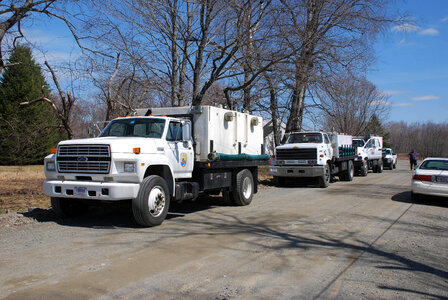 Fleet of trucks at Atlantic salmon release site photo