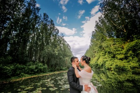 Hugging groom kiss photo