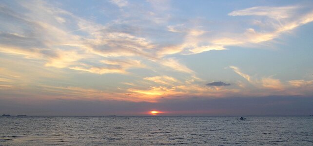 Water orange clouds photo