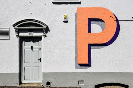 Grey Wall with Orange Letter and the Grey Door photo