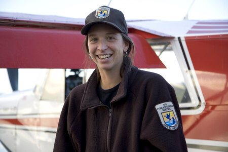 Service employee by a plane at Yukon Flats Wildlife Refuge