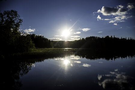 Bright Sun over Day lake in Chequamegon National Forest, Wisconsin