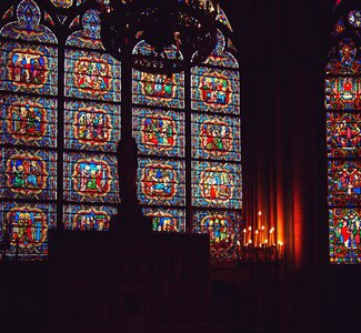 Stained glass windows candles dark photo
