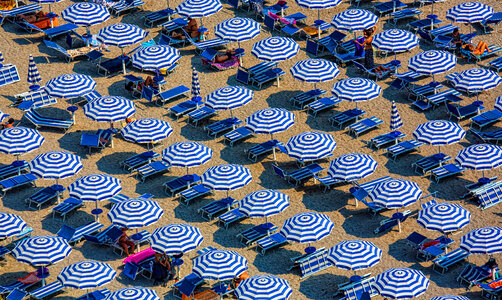 Plenty of Striped Umbrellas on the Beach photo