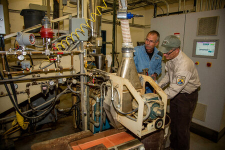 Fish Nutritionist checks quality control of fish food-1 photo