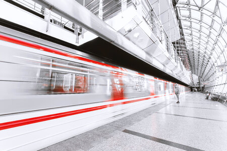 Beautiful glass subway stop and metro in motion photo