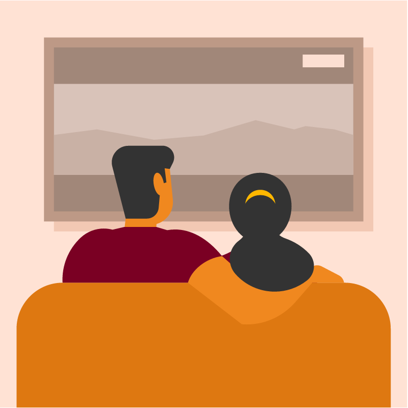Couple Watching TV on Couch