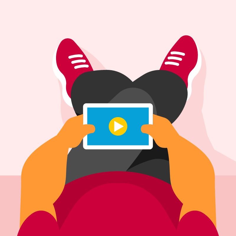 Man Sitting and Holding a Tablet for Entertainment