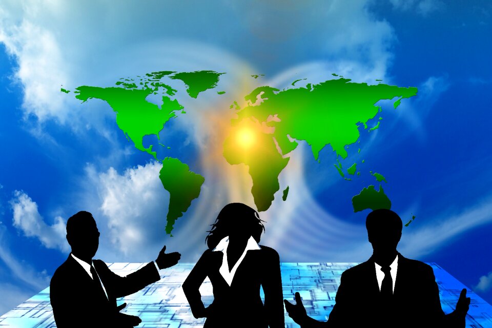 Businessmen continents clouds
