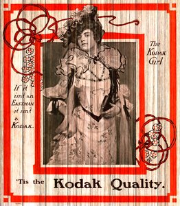 Kodak girl feather hat gown