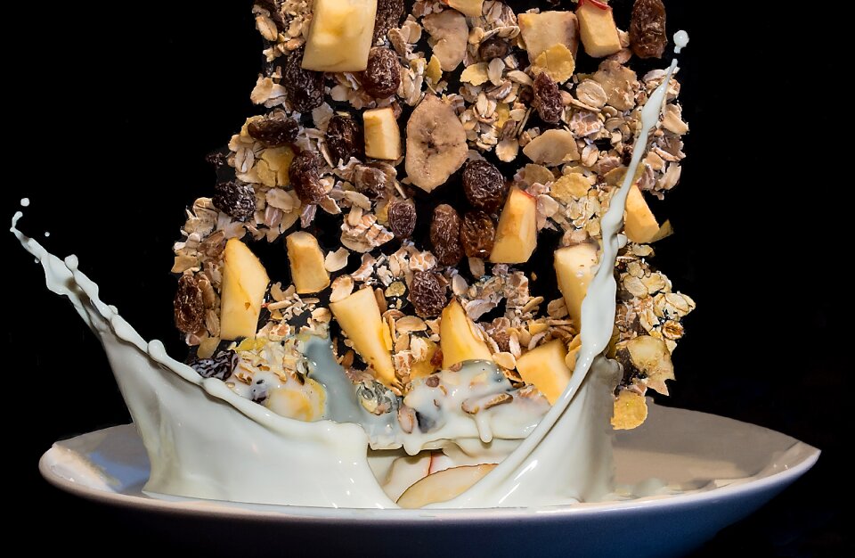 Milk falling muesli drops of milk