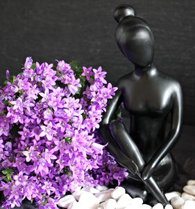 Statue beautiful woman flowers
