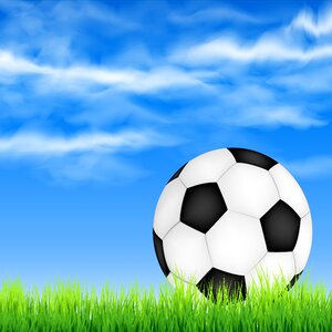 Football ball grass sky