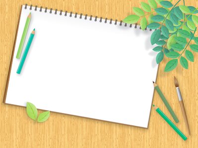 Paintbrush notepad wood background