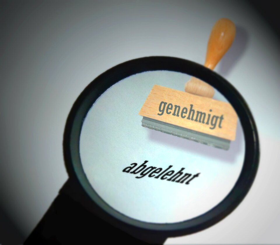 Stamp bureaucracy magnifying glass