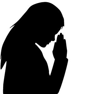 Silhouette praying woman