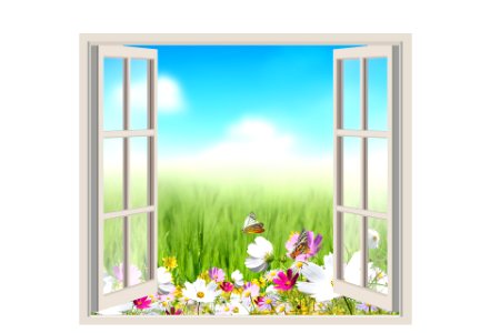 Open window with green field under blue sky on a background