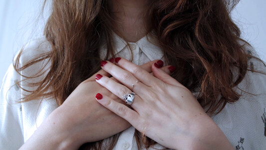 Woman with Red Nails and Silver Rings photo