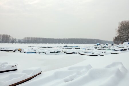 Snowy frozen boats photo