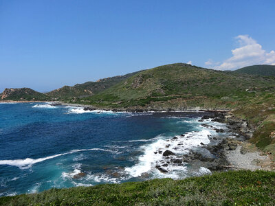 Shoreline landscape with hills in Corsica photo