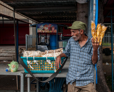 Fried banana seller, popcorn and peanuts photo
