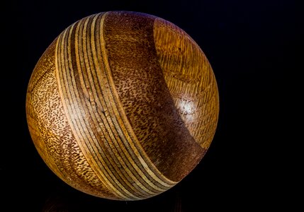 Wooden ball turned hand labor photo
