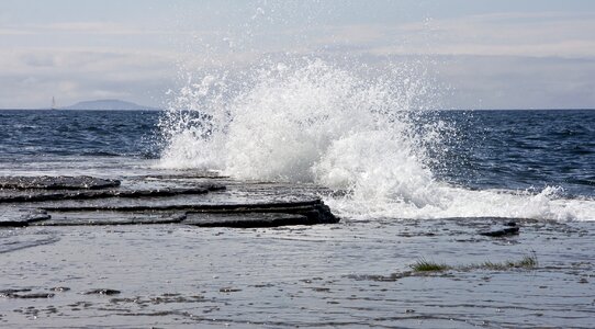 Huge waves crashing on the rocks of Oland, Sweden. photo