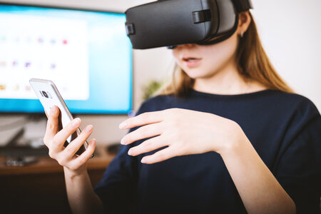 Woman using the virtual reality headset photo