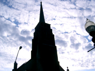 Church tower on Christian church with clouds as background photo