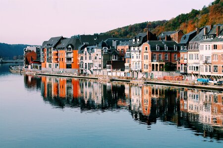 Buildings Reflecting in the Meuse River Dinant, Belgium photo