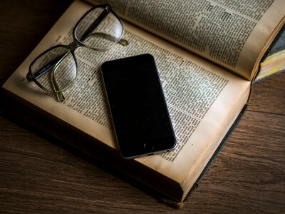 Book eyeglasses mobile phone