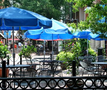 Chairs umbrellas outdoor dining photo