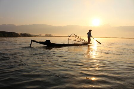 Fishermen during sunrise at Inle Lake photo