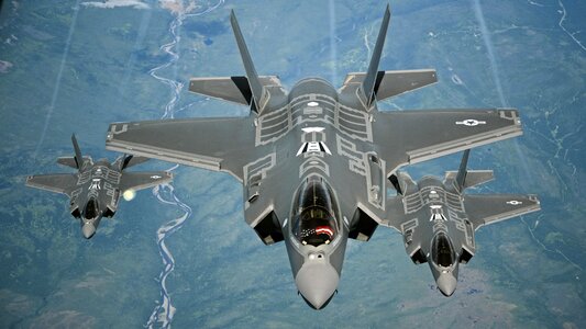 F-35A Lightning II aircraft receive fuel from a KC-10 photo