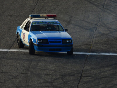 Old police car spinning in turn photo