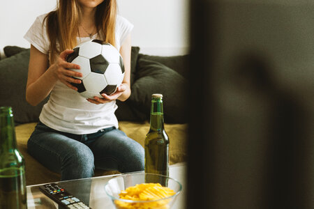 Girl watching soccer match photo