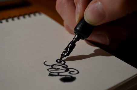 Pen Ink Hand Paper photo