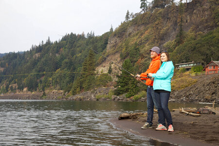 Young couple fishes for Fall Salmon-1 photo