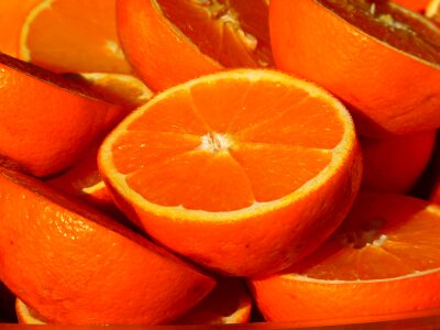Closeup of sliced oranges on a market photo
