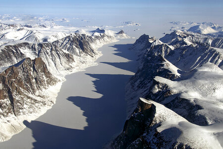 Ice covered fjord on Baffin Island with Davis Strait in the back in Nanuvut, Canada photo