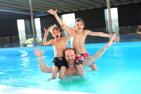 happy children kids group at swimming pool class learning photo