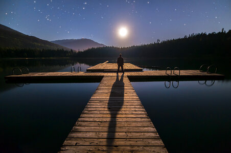 Standing on the docks looking at the moon and stars in British Columbia photo
