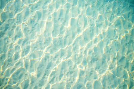 Light Blue Rippled Sand under Water Texture photo