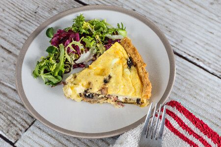 Plate with a Piece of Tart and Lettuce photo