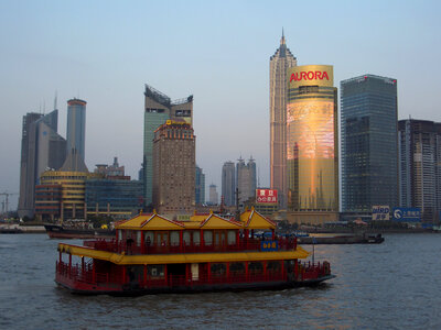 Skyline of Pudong, Shanghai, China behind a boat photo