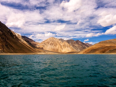 Landscape with mountains, sky, and clouds in Ladakh, India photo