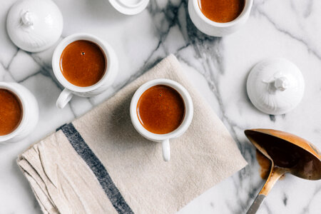 Cups of Coffee or Chocolate on Marble Table photo
